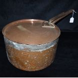 A LARGE COPPER SAUCEPAN AND LID with iron handles, the pan 31.5cm diameter 17.5cm high Condition