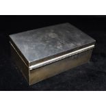 A SILVER BOX OF PLAIN FORM with a geometric small engraving to lid, the box inlaid with wood and