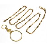 A 9CT GOLD GUARD CHAIN AND GOLD PLATED MAGNIFYING GLASS The curb link chain fitted with an Albert