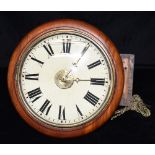 A 19TH CENTURY POSTMANS ALARM CLOCK the dial with Roman numerals, 30cm diameter overall
