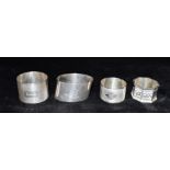 A COLLECTION OF FOUR SILVER SERVIETTE RINGS weight 114grams