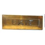 A BRASS EXIT SIGN possibly from a cinema, with cut-out lettering, a decorative cast border and a