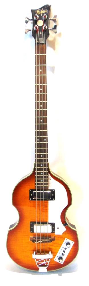 A HOFNER 'VIOLIN' RIGHT-HAND UNBRANDED COPY ELECTRIC BASS GUITAR with a hollow body, 109cm high.