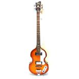A HOFNER 'VIOLIN' RIGHT-HAND UNBRANDED COPY ELECTRIC BASS GUITAR with a hollow body, 109cm high.