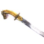 AN INDIAN TULWAR with a 73cm typically curved triple-fullered steel blade, and a brass hilt with a