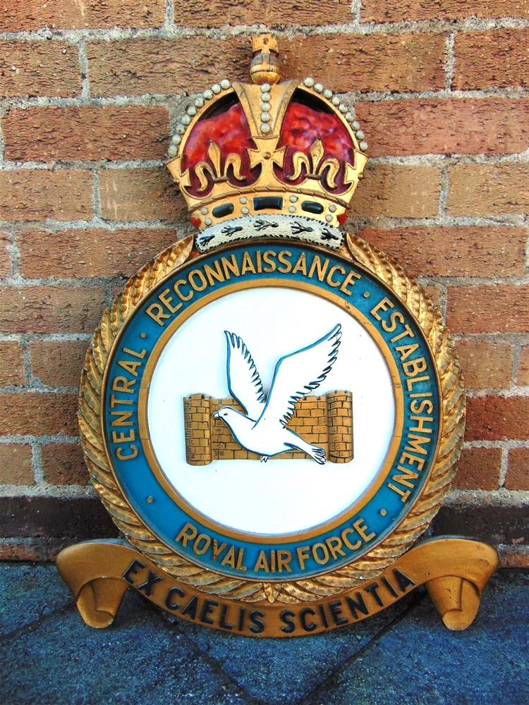 A ROYAL AIR FORCE CENTRAL RECONNAISSANCE ESTABLISHMENT LARGE WALL BADGE of carved and painted wood