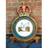 A ROYAL AIR FORCE CENTRAL RECONNAISSANCE ESTABLISHMENT LARGE WALL BADGE of carved and painted wood