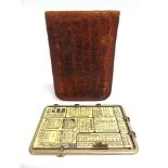 A KAUFMANN LE POSOGRAPHE EXPOSURE CALCULATOR early 20th century, in original brown leather wallet,