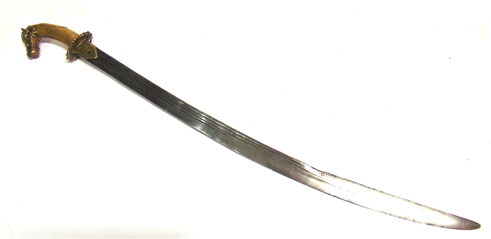 AN INDIAN TULWAR with a 73cm typically curved triple-fullered steel blade, and a brass hilt with a - Image 2 of 4