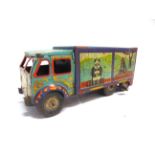 A METTOY TINPLATE 'BINGO'S CIRCUS' LORRY with a clockwork motor (working), 24cm long. Condition