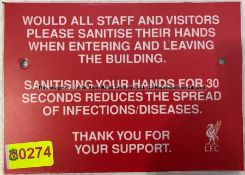 Two SANITISE HANDS signs from the External Wall at Liverpool Football Club's Melwood Training