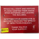 Two SANITISE HANDS signs from the External Wall at Liverpool Football Club's Melwood Training