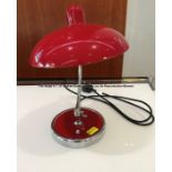 Red desk lamp from Jurgen Klopp's Manager's Office at Liverpool Football Club's Melwood Training