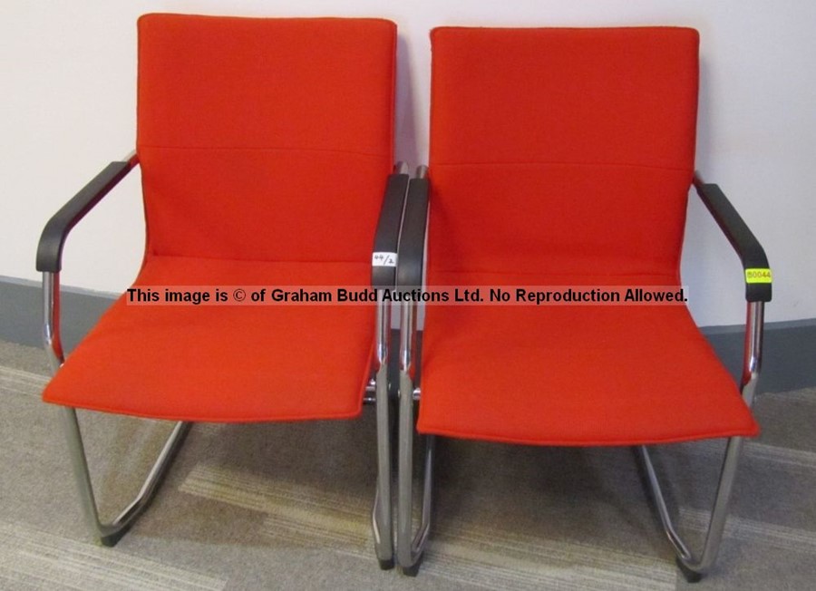 Two matching red upholstered audience chairs from the Press Conference Room at Liverpool Football