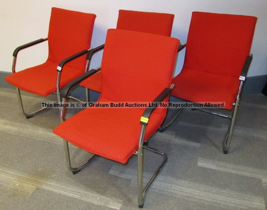 Four red upholstered audience chairs from the Press Conference Room at Liverpool Football Club's