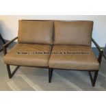 Tan faux leather two-seater sofa from the First Team Changing Room at Liverpool Football Club's