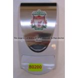 Hand sanitiser dispenser with LFC crest from the First Team Changing Room, at Liverpool Football