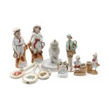 Collection of china and pottery Lawn Tennis themed fairings, tennis racquets and figures, late