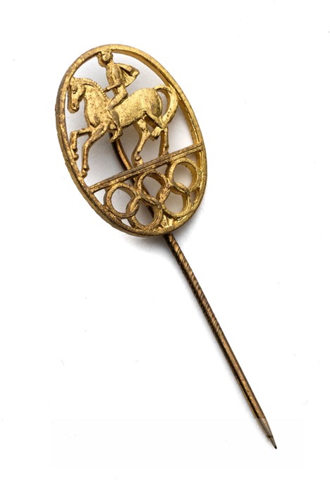 1956 Stockholm Olympic Games gilt metal equestrian lapel pin, of oval form with pierced horseman