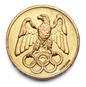 German 1936 medal baring Olympic RIngs, gilt metal, of circular form, obverse with the German eagle