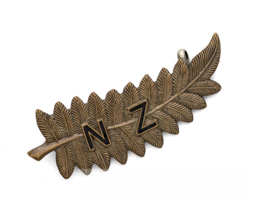1924-25 New Zealand All Blacks touring team gilt metal fern lapel badge, in the form of a fern