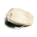 An original white fabric tennis cap with visor, circa 1930s, peaked cap with bluish plastic visor,