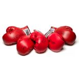 Group of five autographed boxing gloves, all red Everlast, with signatures in black marker pen,