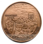 1968 Grenoble Winter Olympic Games copper participation medal, designed by J.H. Coeffin, of