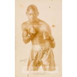 Kid Chocolate signed b & w boxing promotional card, circa 1930s, depicting Kid Chocolate in fight