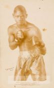 Kid Chocolate signed b & w boxing promotional card, circa 1930s, depicting Kid Chocolate in fight