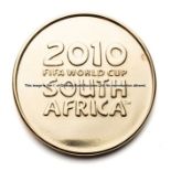 2010 FIFA World Cup commemorative gilt medal, of circular form, obverse relief of the World Cup