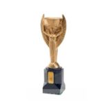 Gilt-laquered replica of the Jules Rimet Trophy, the base set with a pair of plaques both