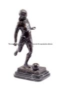 Stanley Matthews spelter figure, modelled as Stanley Matthews kicking a ball, raised upon a plinth