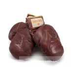 Muhammad Ali signed pair of vintage red leather 'Golden Gloves' boxing gloves, both signed in gold