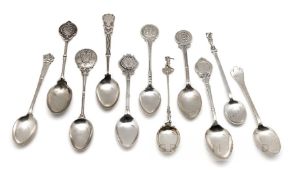 Eleven English hallmarked silver prize golf spoons, the finials with golfing scenes, golf figures,