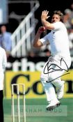 England cricket legend Sir Ian Botham signed red cricket ball and photograph, the photo an 8 by