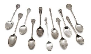 Eleven hallmarked English silver prize golf spoons, the finials with golfing scenes, golf figures,