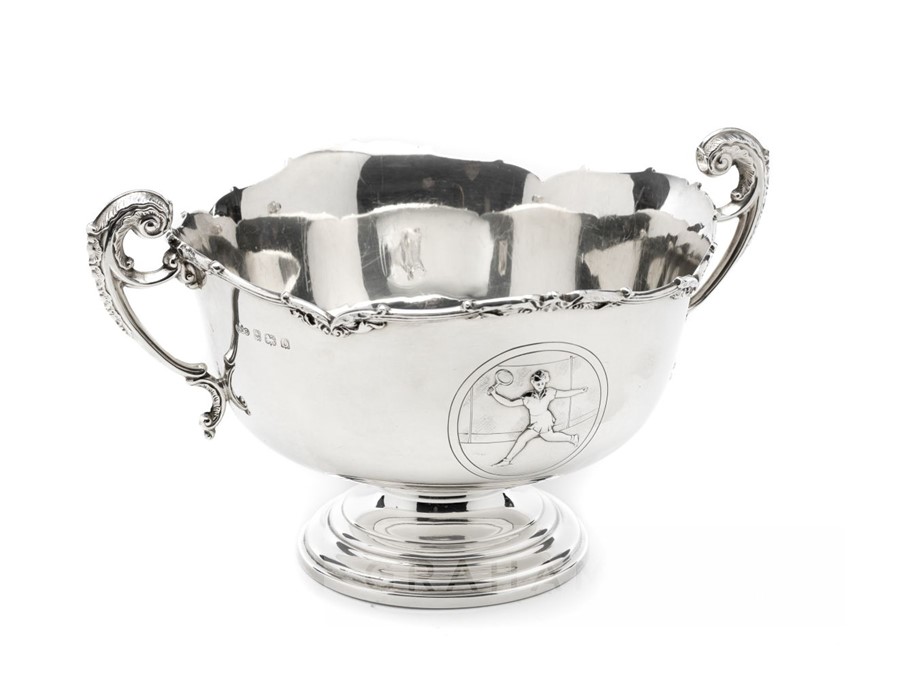 Twin-handled silver Lawn Tennis trophy, scallop-edged trophy cup featuring embossed female tennis