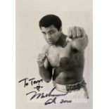 Muhammad Ali signed b&w photograph, 7 by 5in., signed in 2000 with dedication “To Tom”