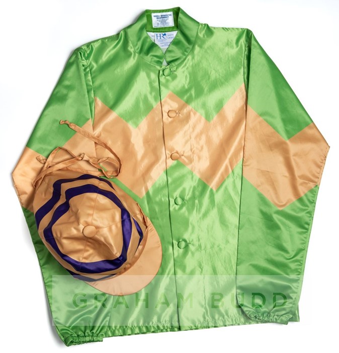 Racing colours of international owner Fung Lok Li, green with gold chevron, gold cap, purple