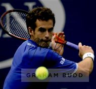 Four signed photographs of Grand Slam tennis champions, all 8 by 10in., comprising Roger Federer,