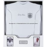 George Cohen signed framed Fulham FC retro jersey, mounted together with two b&w photos, title