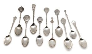 Collection of 33 English hallmarked silver prize golf spoons, the finials with golfing scenes,