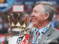 Two Sir Alex Ferguson and David Beckham signed Manchester United colour photographs, one featuring