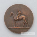 A Fegentri bronze horse racing medallion presented to Luca Cumani, of circular form, obverse with