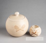 Rare twin ceramic pieces consisting of a Victorian tobacco jar and a match striker each showing
