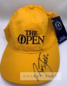 Sir Nick Faldo (ENG) signed yellow "The Open" winner's cap, with COA incorporating photo proof of