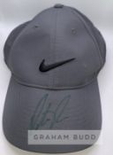 Patrick Reed (USA) signed Nike cap and action photo, cap his own sponsor and branding signed on peak