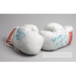 Lennox Lewis and Frank Bruno signed Lonsdale white boxing gloves, circa 1993, the pair of white