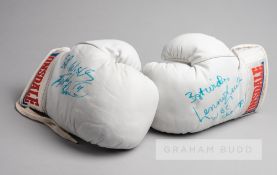 Lennox Lewis and Frank Bruno signed Lonsdale white boxing gloves, circa 1993, the pair of white